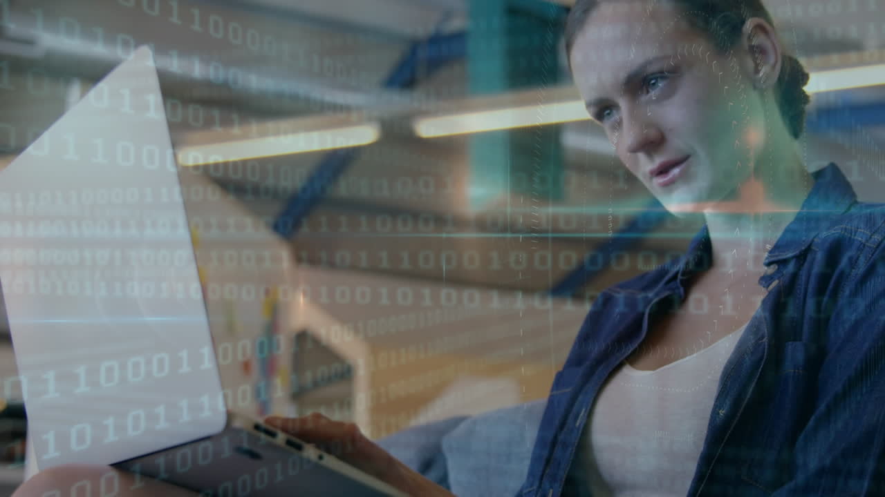 Animation of qr code in abstract pattern over caucasian teacher working on laptop in classroom