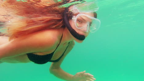 woman snorkeling underwater