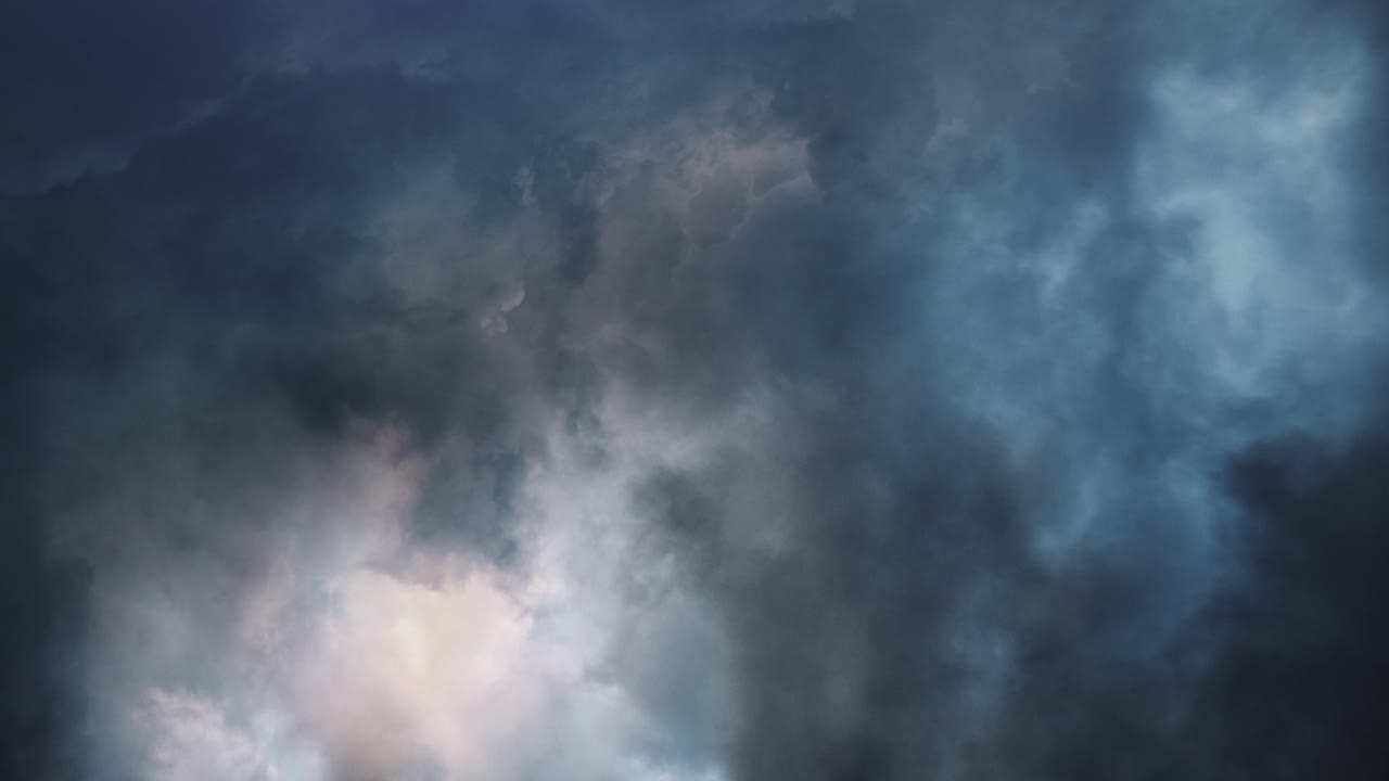 fly through dark clouds and thunderstorm