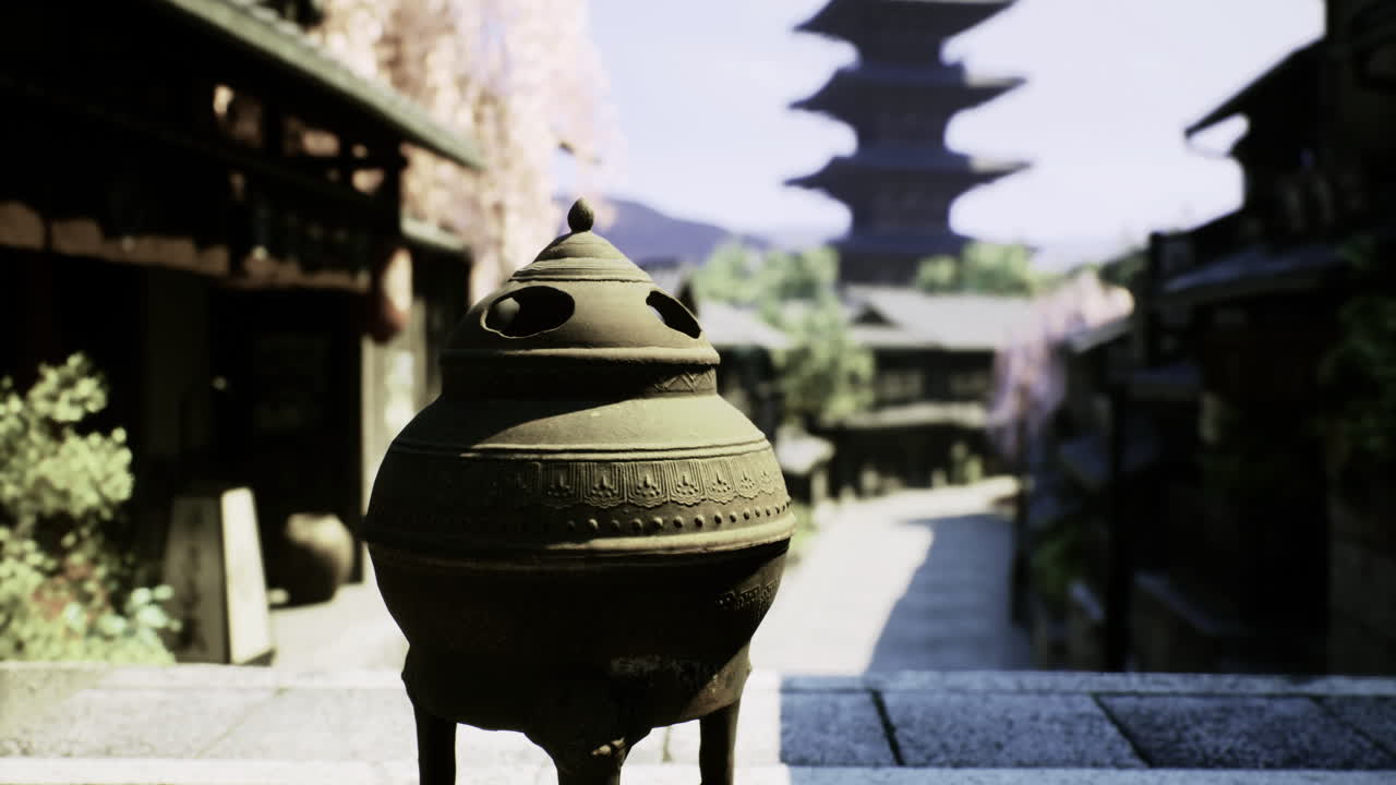 Traditional incense burner in historic japanese street with pagoda