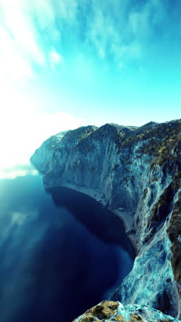aerial view of a dramatic cliffside overlooking the ocean