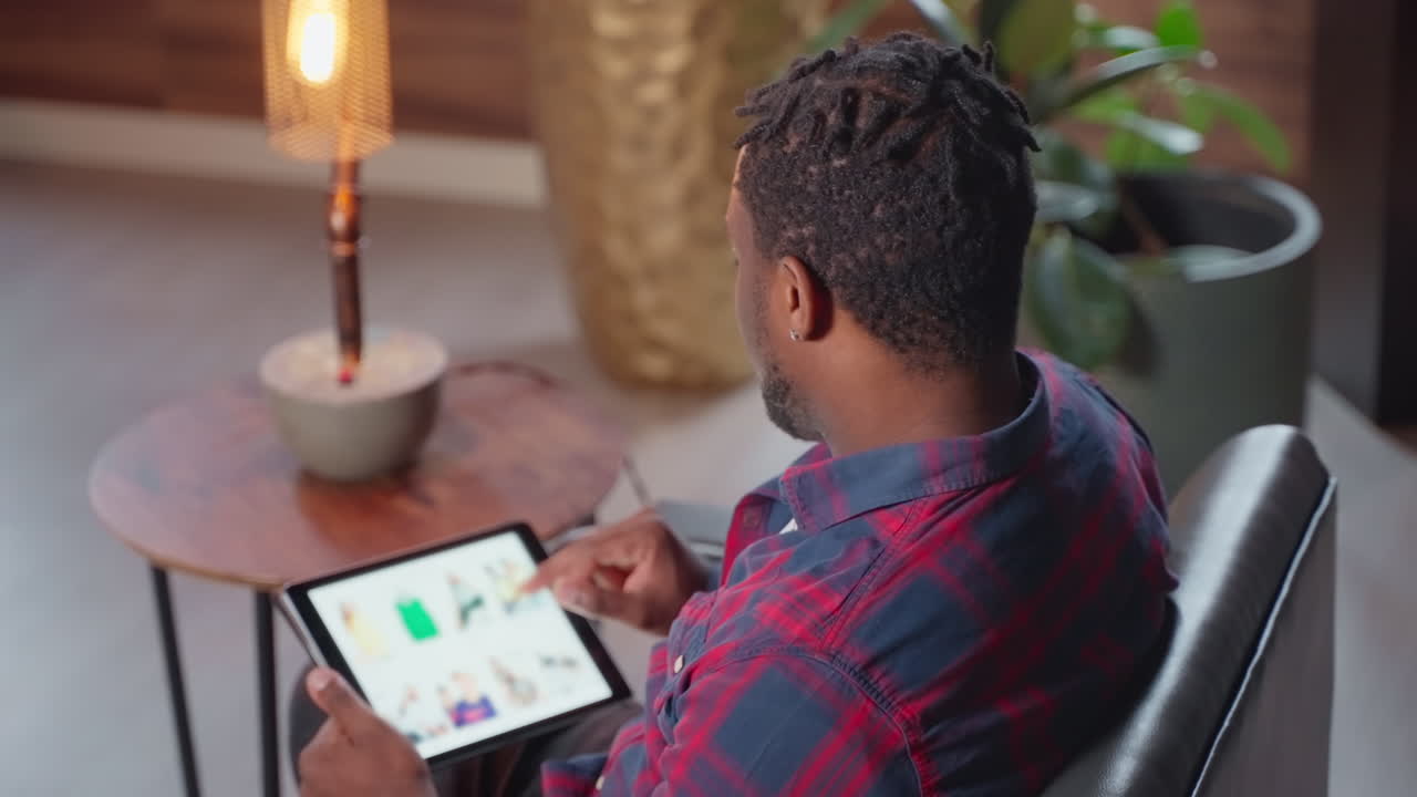 Man shopping online on tablet