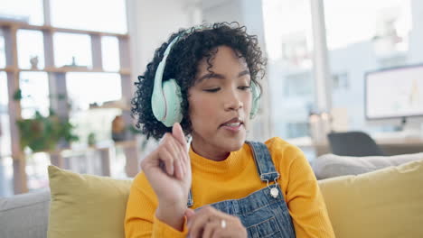 Music,-energy-and-dance-with-woman-on-sofa