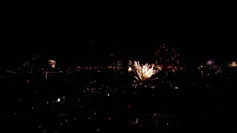 aerial view of fireworks going off at night