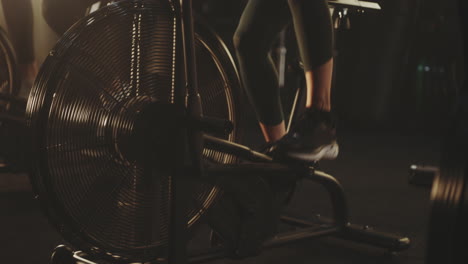 people exercising on exercise bikes in a gym