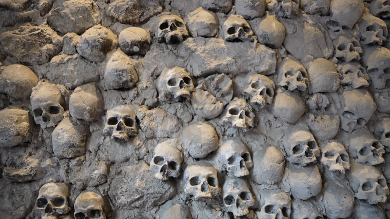 Skulls embedded in a wall, Liguria, Italy, evoke mystery and history
