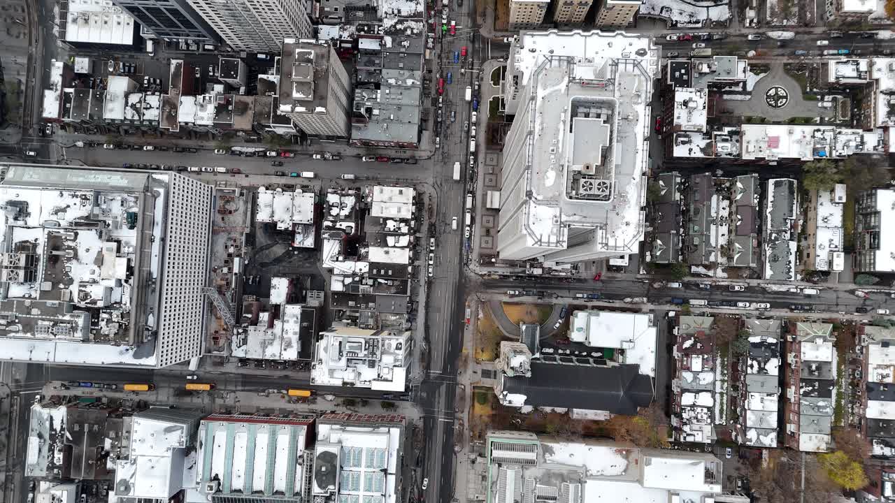 Bird's-eye view of a bustling city with modern buildings and busy streets, Montreal, Canada