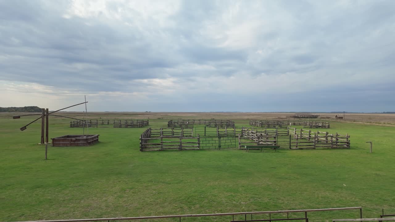 Gorgeous landscape view of the Great Plain with a traditional draw well and empty corral on Hortobágy in Hungary