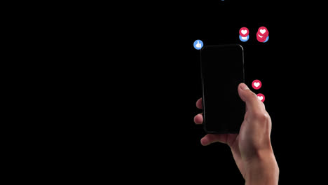 a hand using phone with likes on black background