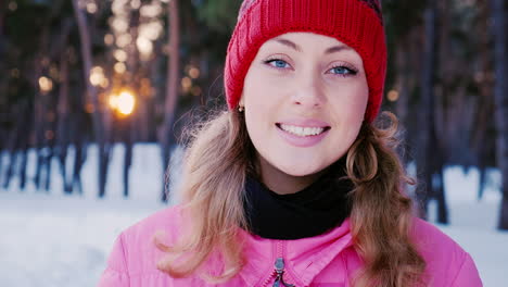 portrait of a young attractive caucasian woman in a winter forest