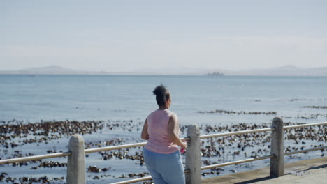 one plus size woman running with dumbbells to get