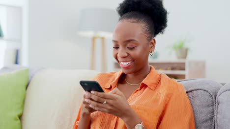 Phone,-happy-and-black-woman-on-a-sofa-typing