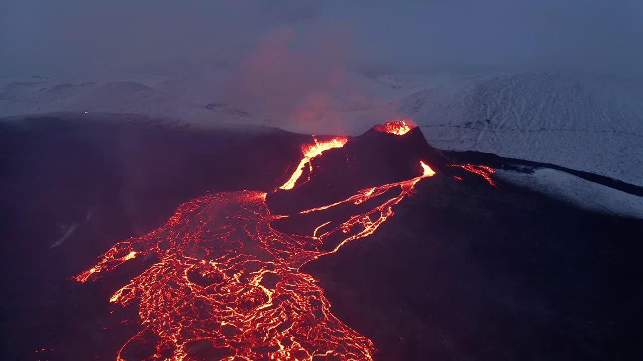 River of hot lava flowing from an erupting Fagradalsfjall Volcano in South Iceland -aerial