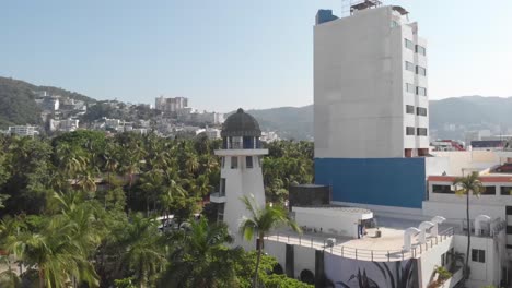 lighthouse near the hotel at the beach of acapulco