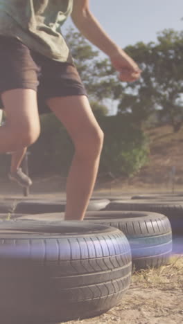 animation of light spots over diverse schoolchildren exercising on obstacle course