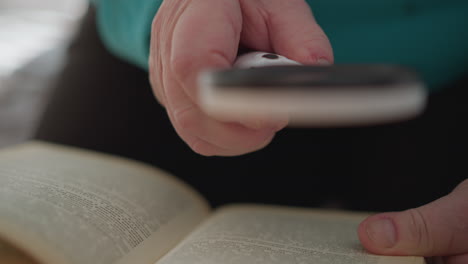 close-up of elderly woman adjusting her glasses with hand, focused on reading a book. soft lighting illuminates wrinkles, showcasing thoughtful expression while performing simple action