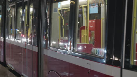 traffic reflects in tram windows in vienna