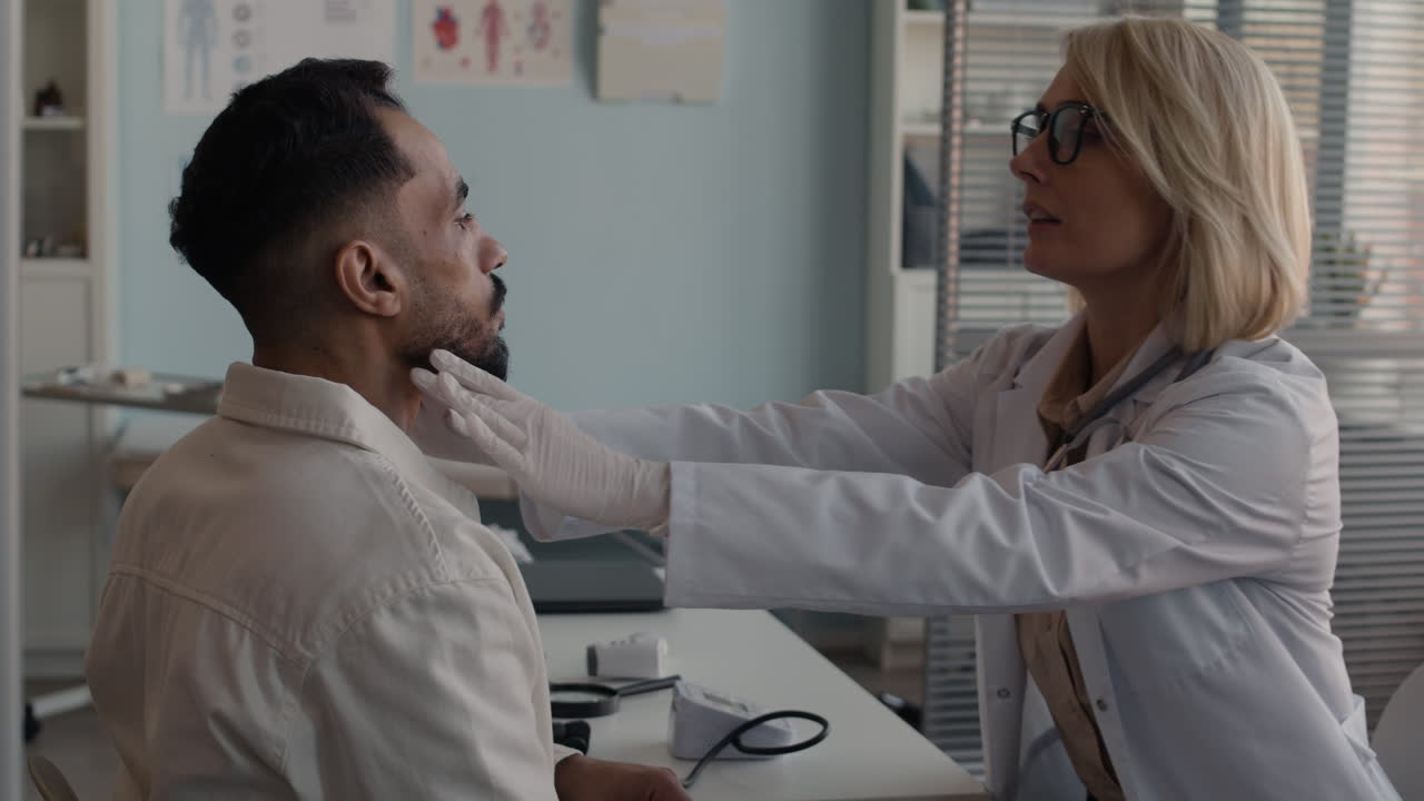 Doctor examining patient in clinic