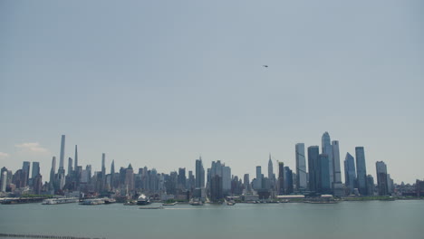 tilt down from passing helicopter to manhattan skyline in new york city, u.s.a.