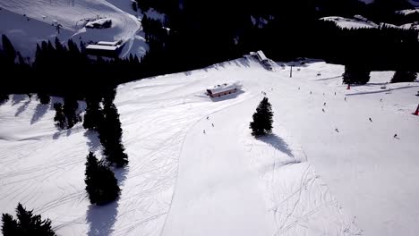 Aerial-of-ski-resort-at-sun-mountains-with-pine-forest