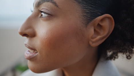 Calm-african-american-looking-camera-closeup.-Peaceful-smiling-model-turn-head