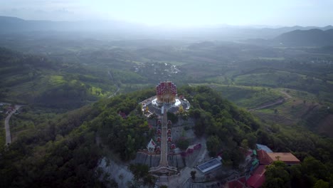 Wat-Pa-Phu-Hai-Long-in-Pak-Chong-in-Nakhon-Ratchasima-is-a-temple-on-top-of-a-small-mountain-with-a-view-of-rice-fields-and-misty-mountains