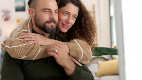 Woman-embracing-her-husband-while-working