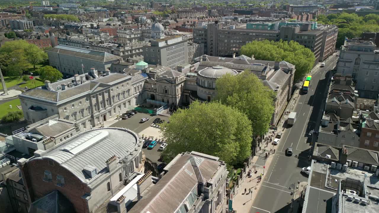 Side-on, rising aerial video of the Seanad Éireann in Dublin City Centre, Ireland on a sunny day. Filmed in 4K, 60FPS with Rec709 Color.
