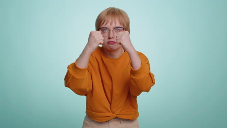 aggressive young woman trying to fight at camera, shaking fist, boxing with expression, punishment