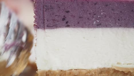 close up of a slice of blueberry cheesecake