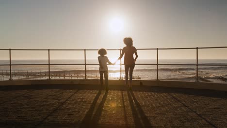 Mother-and-son-having-fun-at-sunset