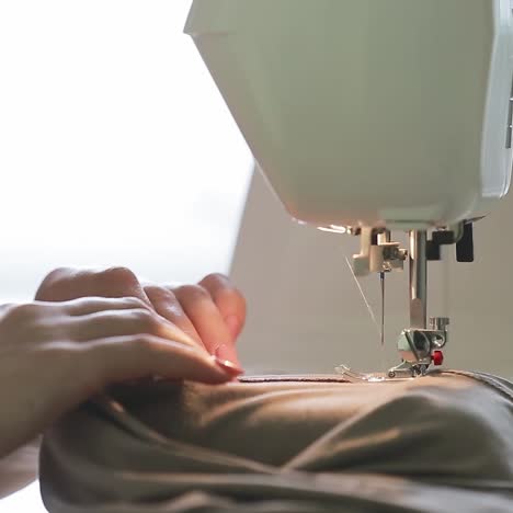 home craft. woman is sewing