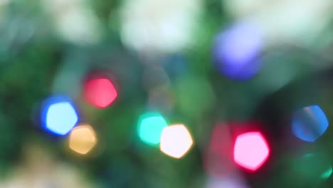 Blurred Christmas festive colorful lights are burning brightly.