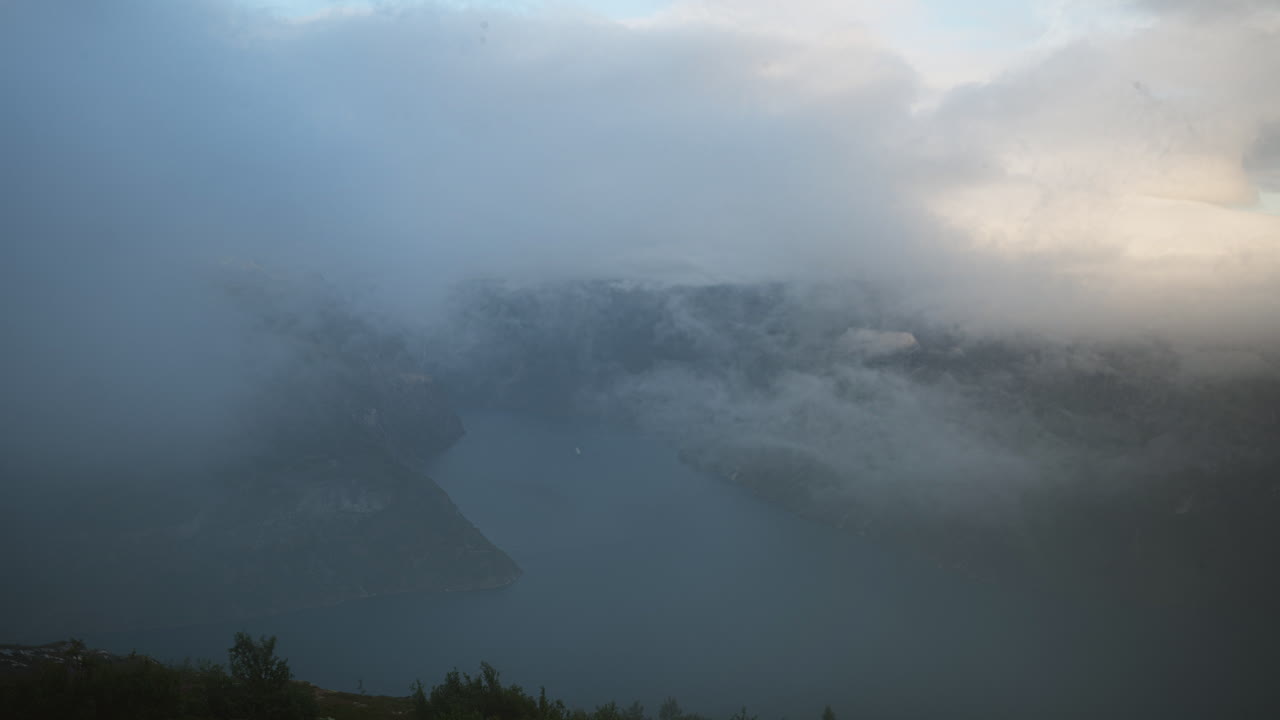 Timelapse of Geirangerfjord from Ljøsætra with the fog coming and covering the fjord