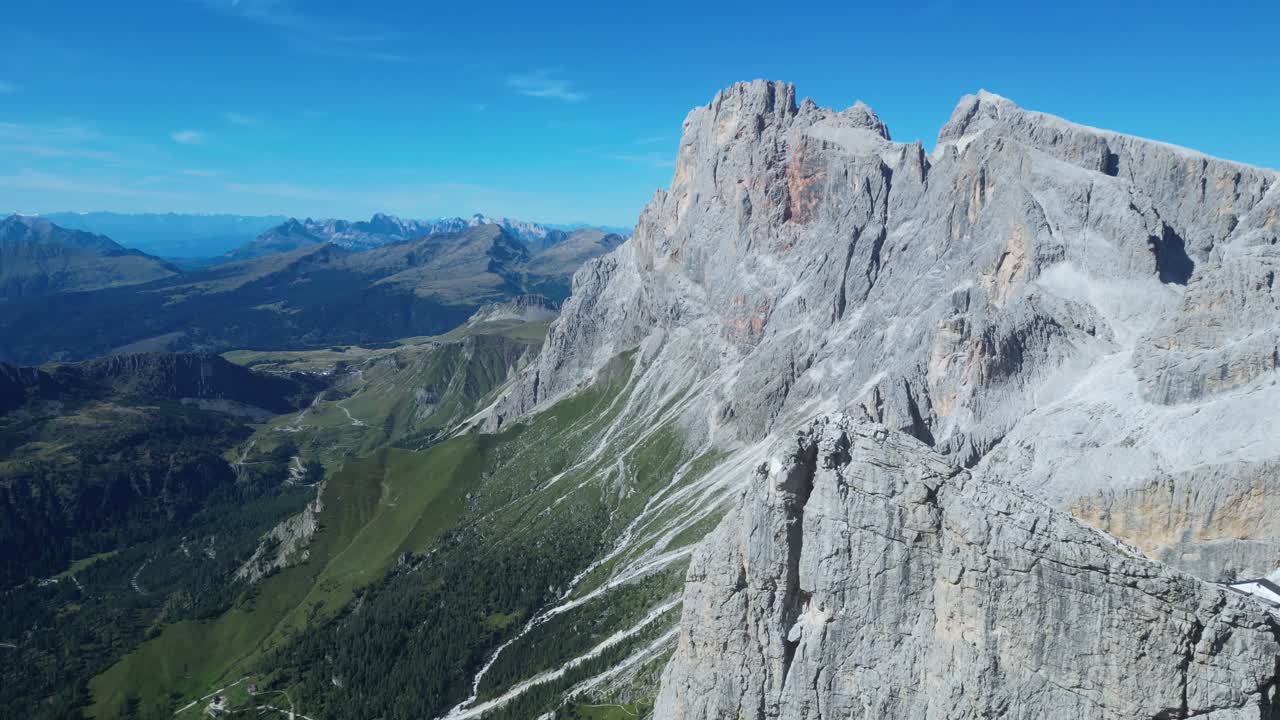 Drone footage of the Pale di San Martino in the Dolomites, Italy: majestic peaks, rocky spires, alpine meadows, and dramatic landscapes ideal for travel, nature, and adventure projects