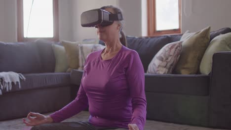 woman using vr headset while performing yoga at home