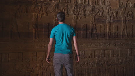 ancient hieroglyphs and carvings on the wall of a temple in dendera, egypt