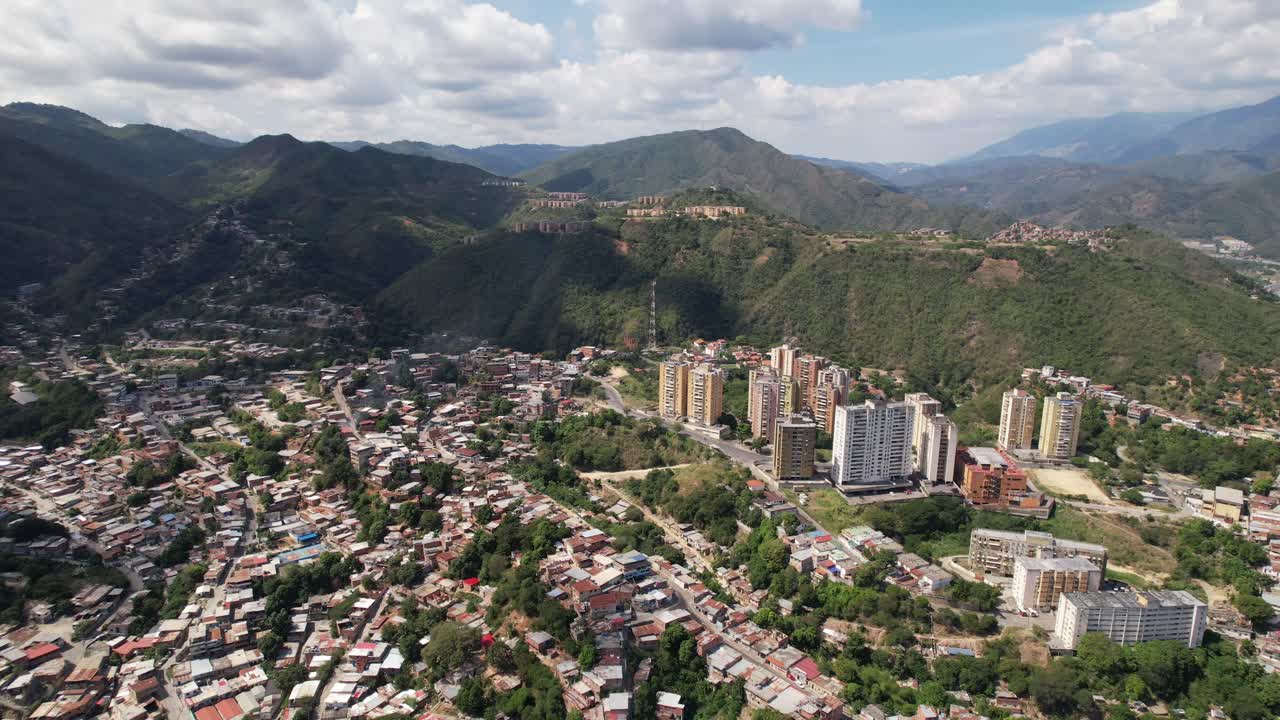 Guarenas city in miranda, venezuela, surrounded by green mountains, aerial view