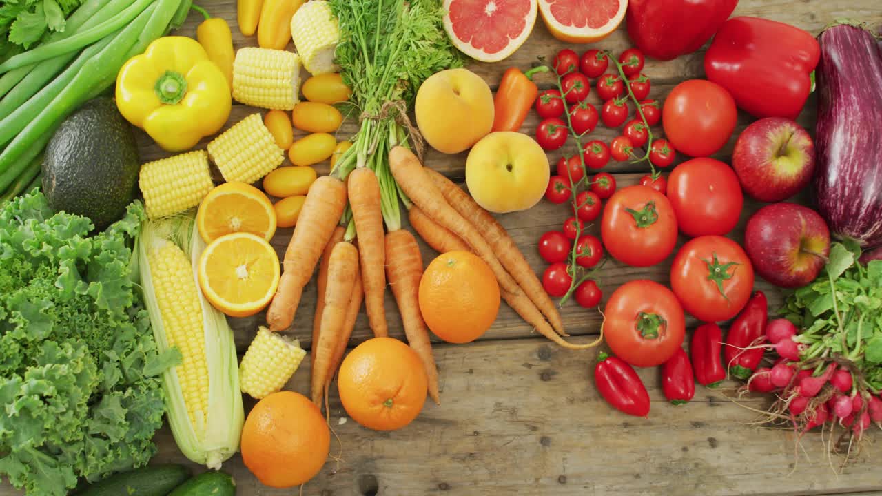 Hearts fading in above fresh produce and floating upward visualizing healthy food appeal