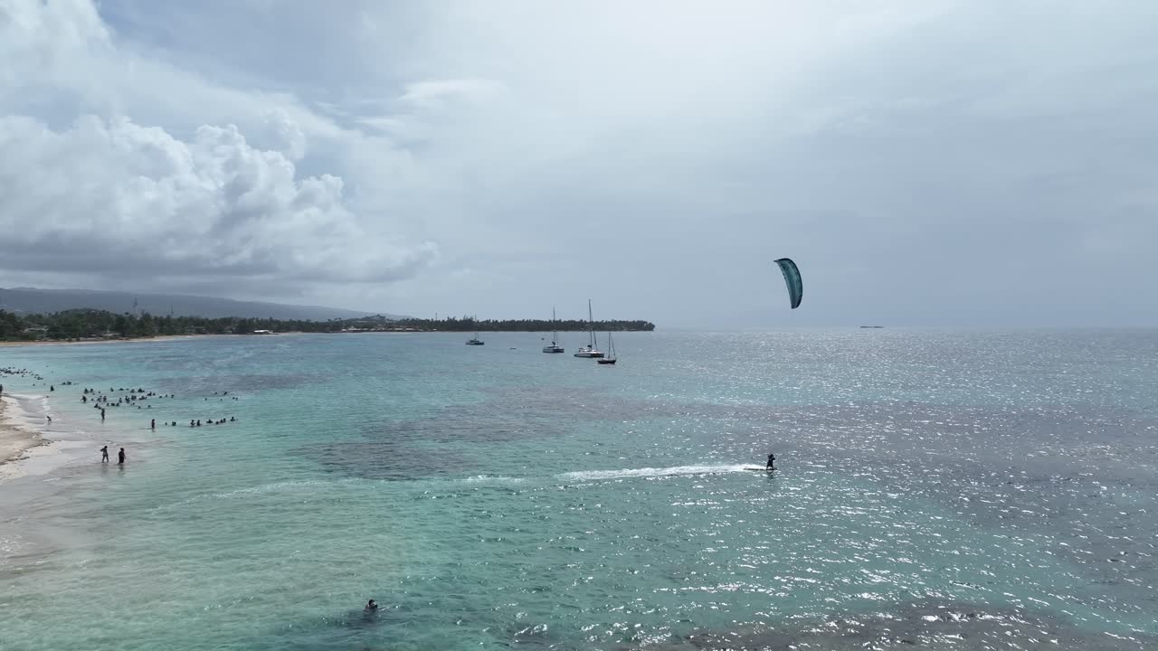 Kitesurfer kitesurfing along tropical beach, exotic seascape, Dominican Republic. Aerial drone. SECOND PART