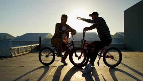 bmx riders on a rooftop