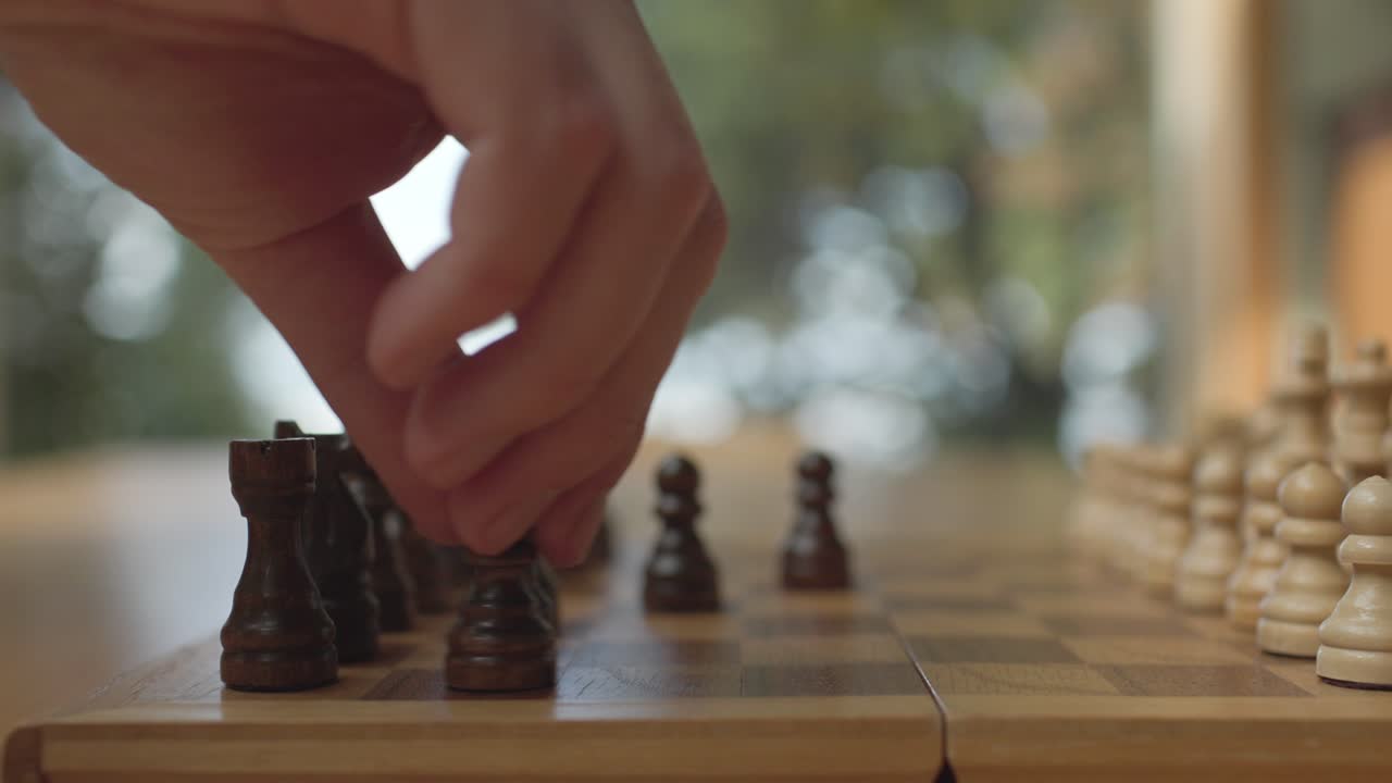 Hand Of Man Playing Chess - Close Up