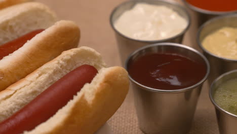 pan across a platter of hot dogs and condiments