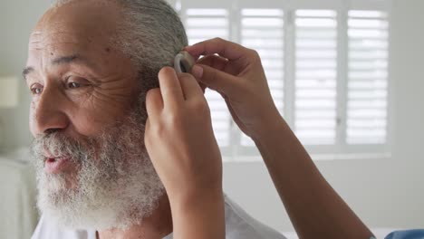 mature man with hearing aid