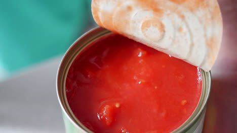 Opening-a-can-of-chopped-Italian-tomatoes