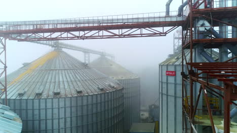 grain silos in foggy conditions