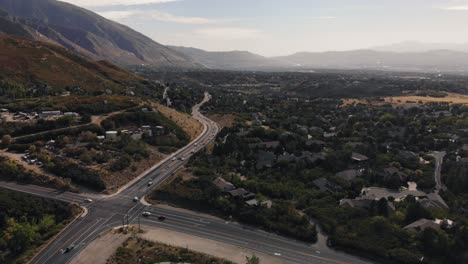 descending drone shot of road near little cottonwood canyon in salt lake city, utah