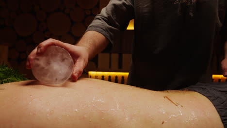 ice therapy back massage in a sauna