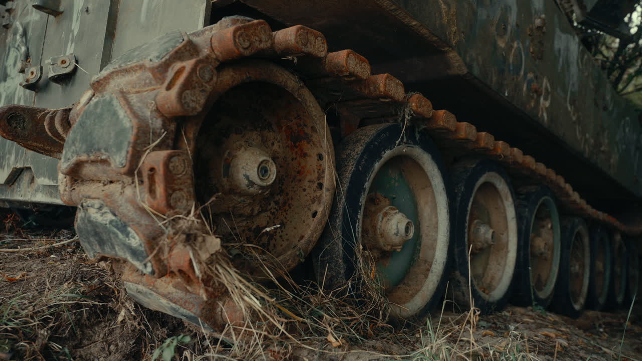 Close-up of Rusty Tracks and Wheels on an Abandoned Military Tank