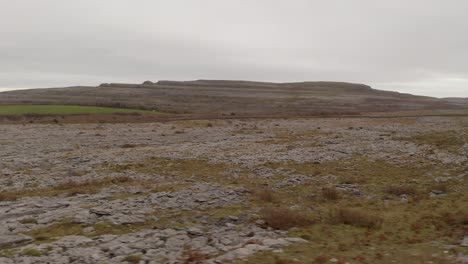 Cinematic-pan-shot-in-Burren-National-park-featuring-terrain-a-rock-Mountain